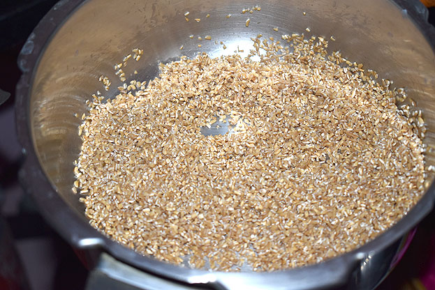 Transfer roasted wheat rava to a plate