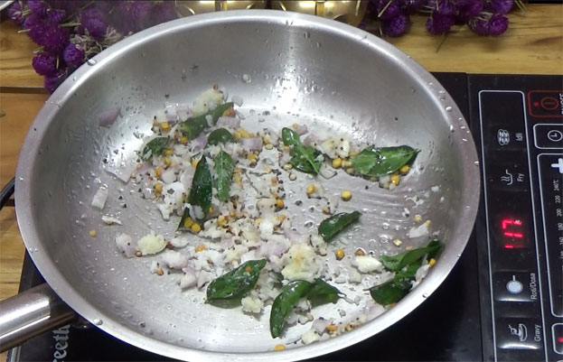 Add green chilli, curry leaves, onion, garlic & coconut