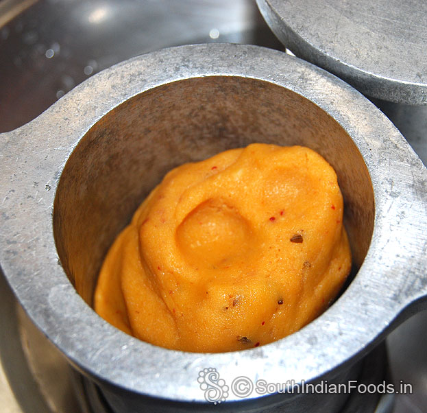 Place one handful dough in murukku kuzhal