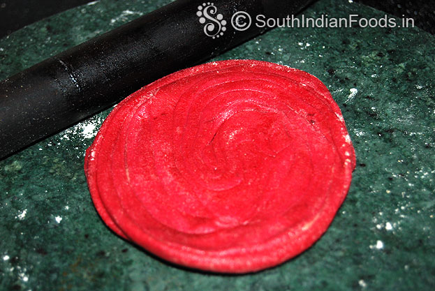Sprinkle flour, roll out into thin or thick paratha