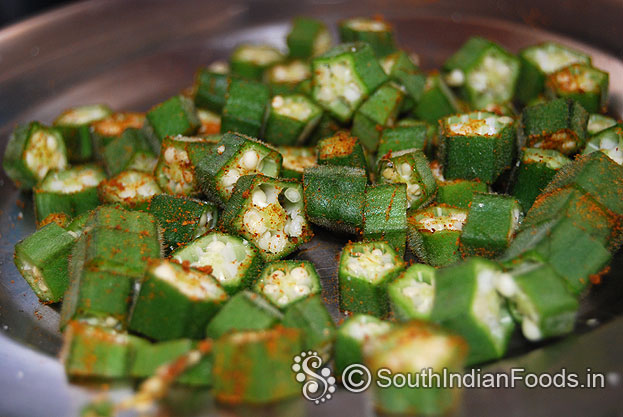 Chop bhindi, add red chilli powder & salt