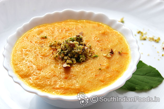 Pour rava payasam into a serving bowl, add grated nuts, serve hot or chilled