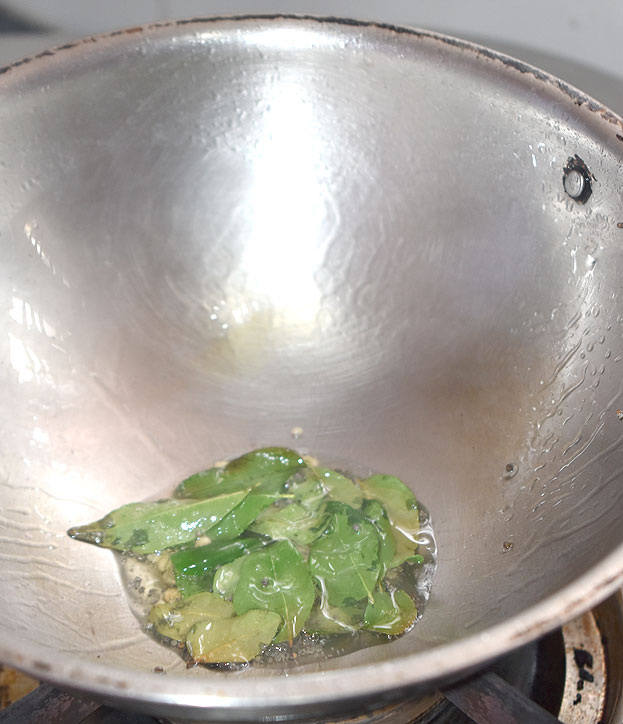 Heat 2 tbsp oil in a pan add Mustard, urad dal, bangal gram, & curry leaves, green chilli