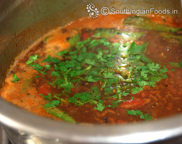 Add chopped coriander leavesin to quick toamto rasam, cut off heat