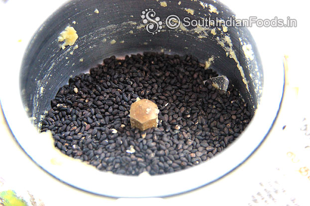 Put roasted sesame seeds in a mixer jar & coarsely grind