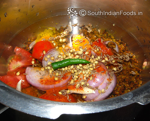 Add gren chilli, cumin, coriander seeds, cover lid, cook for 4 whistles