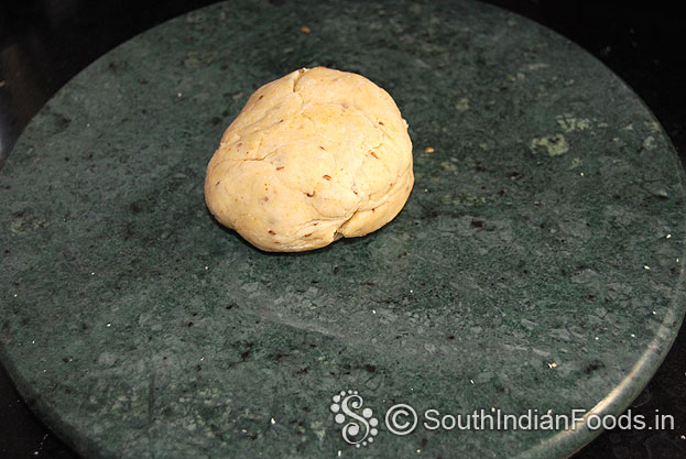 Place dough on chapathi stone, roll out into thick chapathi