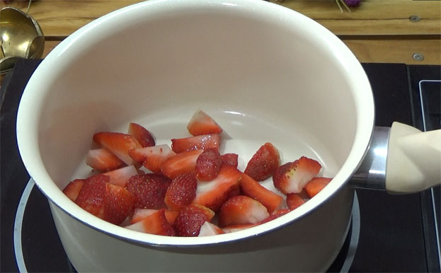 Heat pan, add strawberry slices