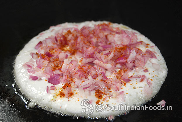 Add idli milagai podi over the uthappam & pour another 1 tbsp of ghee