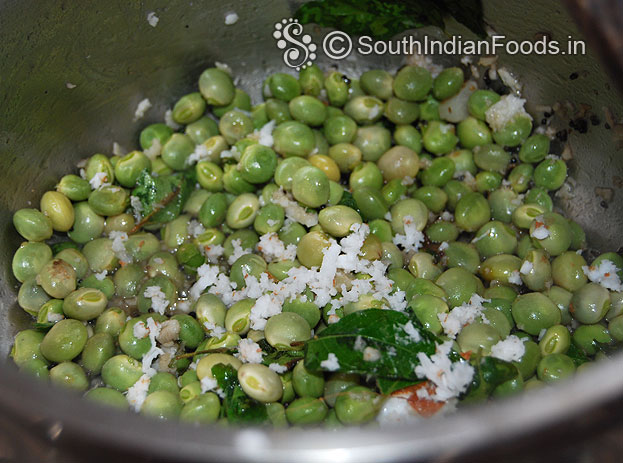 Add boiled green toor dal & coconut