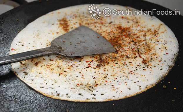 Pour oil & ghee around dosa, gently press cook till crisp and golden brown
