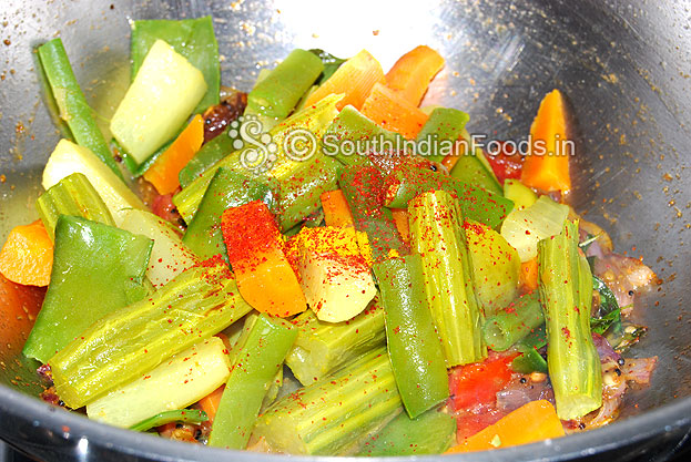 Add boiled vegs, turmeric, red chilli powder & salt saute