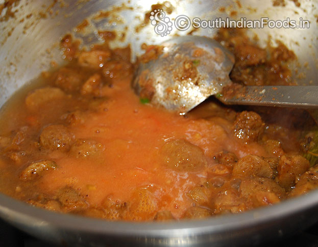 Add tomato puree, let it boil