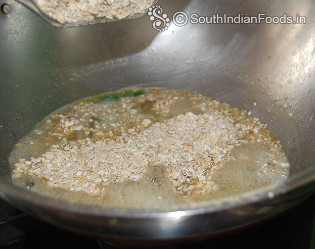 Then add oats and salt mix well in low flame then cover lid cook for a min.