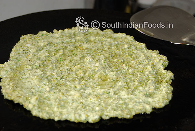 Heat iron dosa pan, pour sprouted green moong batter spread, pour oil