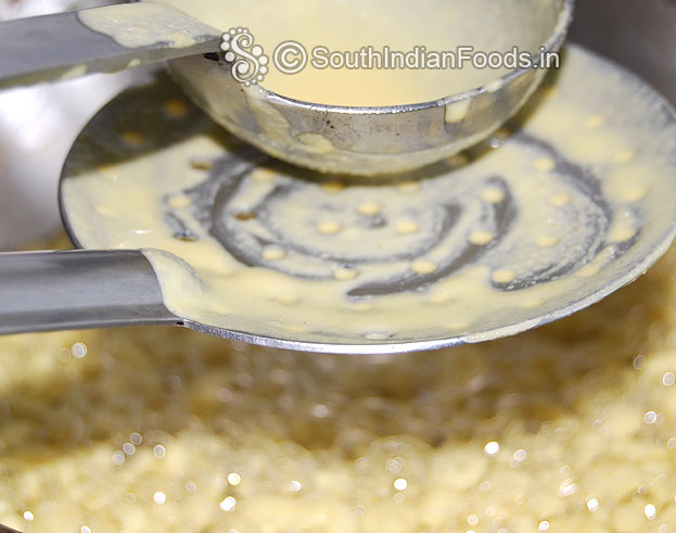 Heat oil, pour batter over the boondi ladle, gently scratch with the ladle