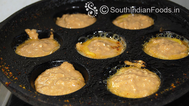 Heat paniyaram pan, add ghee, pour batter, cook till crisp and golden brown