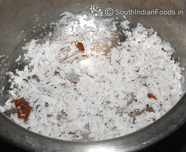 Heat 1 tbsp ghee in a pan, add coconut raost