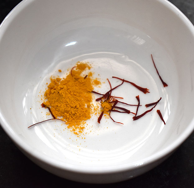 In a bowl add turmeric powder, saffron, add hot water, soak it for 10 min