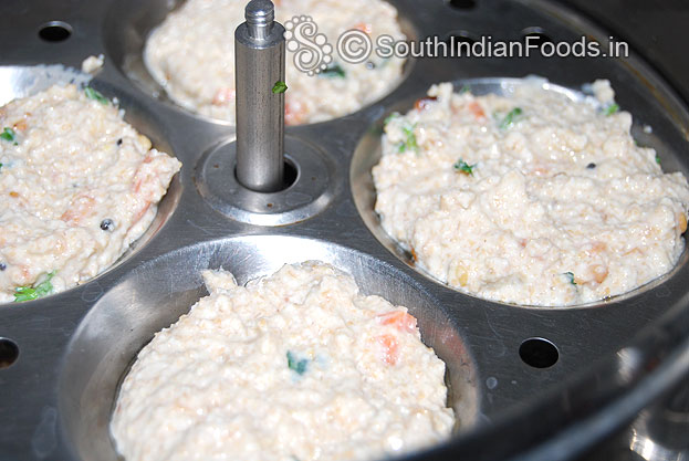Pour batter in an idli plates, cover lid & steam it for 10 min