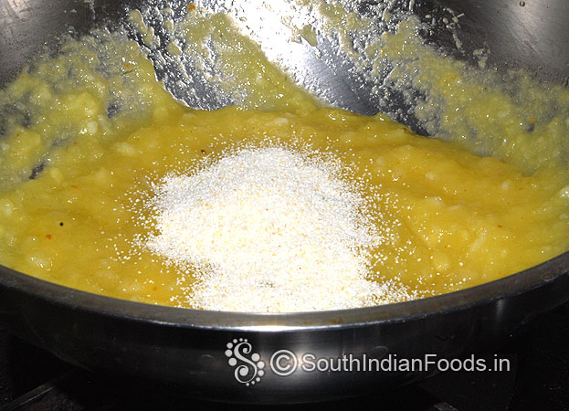 Add rava, stir well till the mixture starts leaving the pan