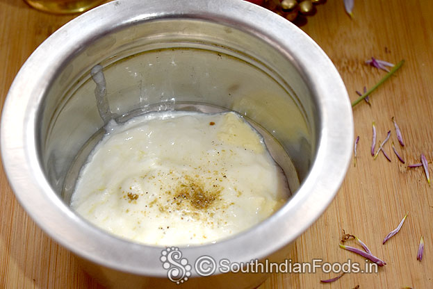 In a bowl add fresh curd, cardamom powder