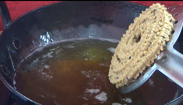 Heat oil in a pan, deep fry till crisp and light brown on medium flame