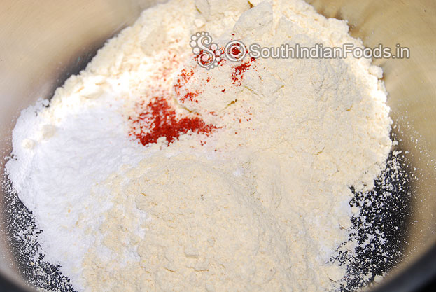 In a bowl add rice flour, gram flour, roasted gram flour, salt & red chilli powder mix well