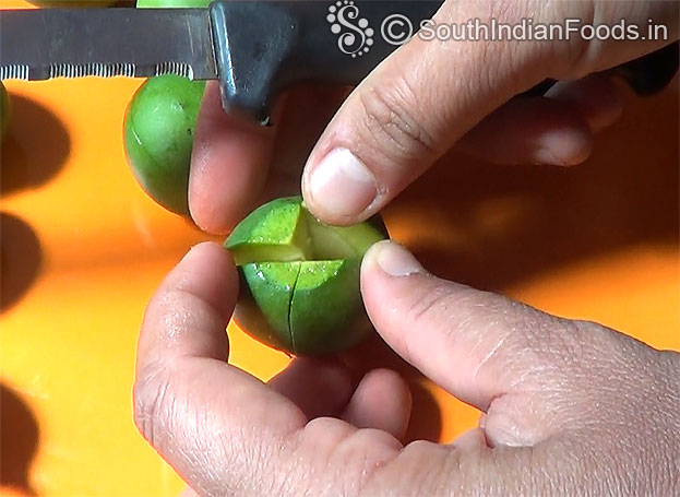 Cut whole small mango into 4
