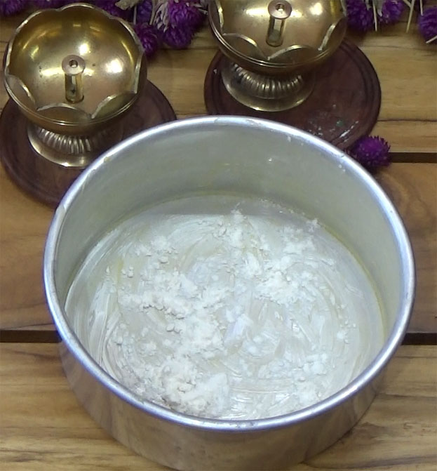 Grease tray with butter then sprinkle flour coat well