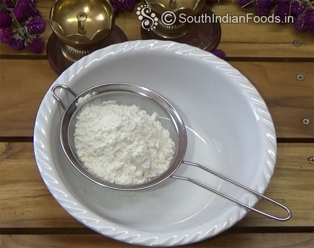 Grease tray with butter then sprinkle flour coat well