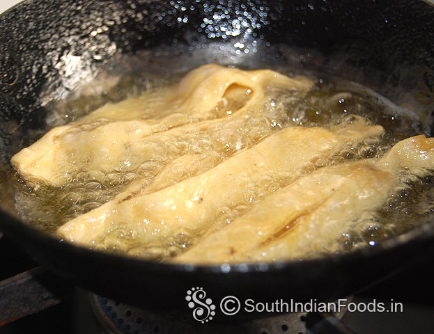 Heat oil in a pan, drop raw champakali in hot oil