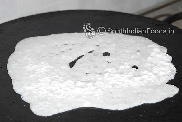 Heat iron dosa tawa, pour batter, drizzle oil, cook both sides