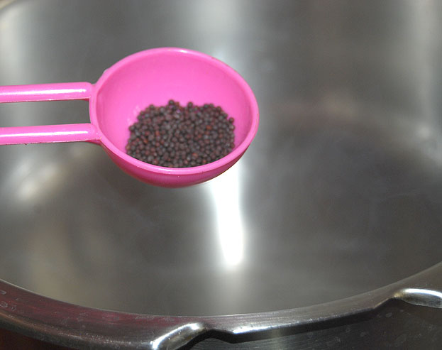 Heat pressure cooker add 2 tbsp oil, add mustard seeds let it splutter