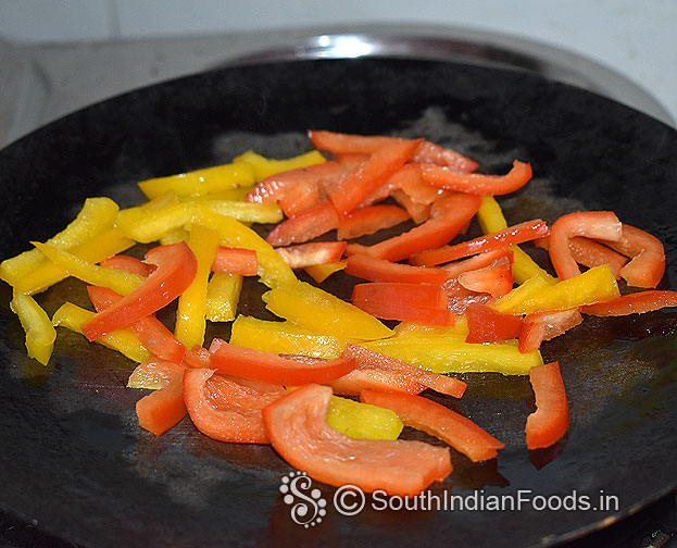Heat iron dosa, add red and yellow capsicum slices, saute 