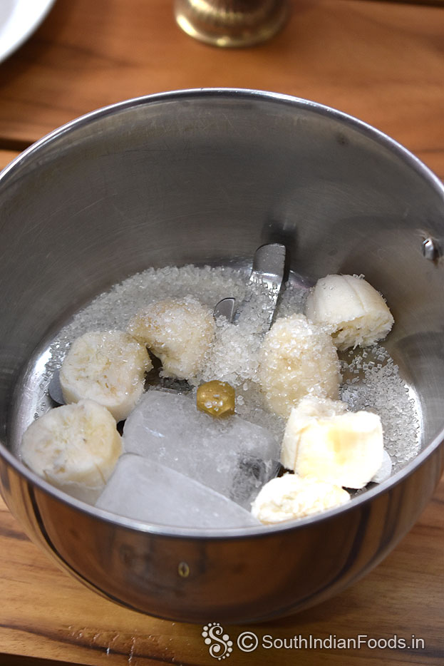 In a mixer jar add banana, sugar, ice cubes