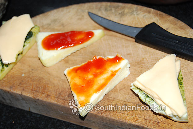 Grease another paneer slice with tomato chilli sauce