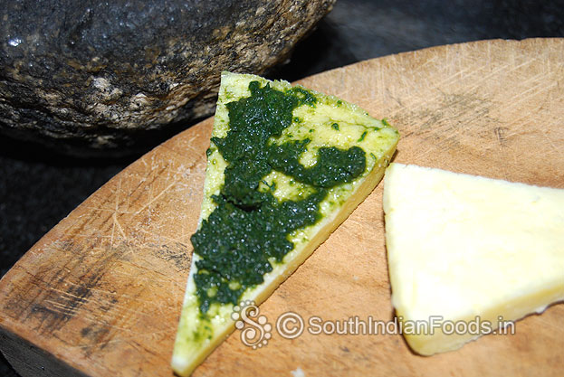 Take one paneer slice, place green chutney & evenly spread