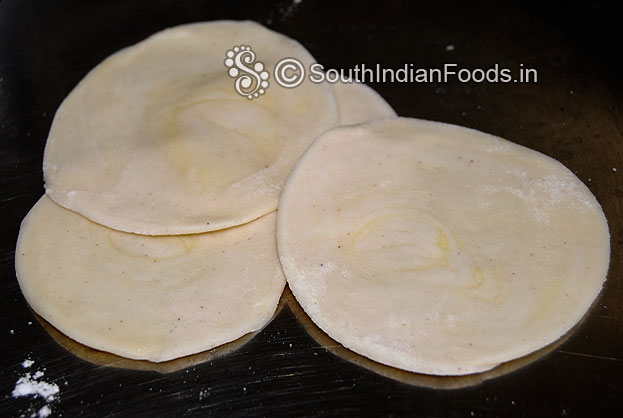 Sprinkle flour, roll out into thin chapati