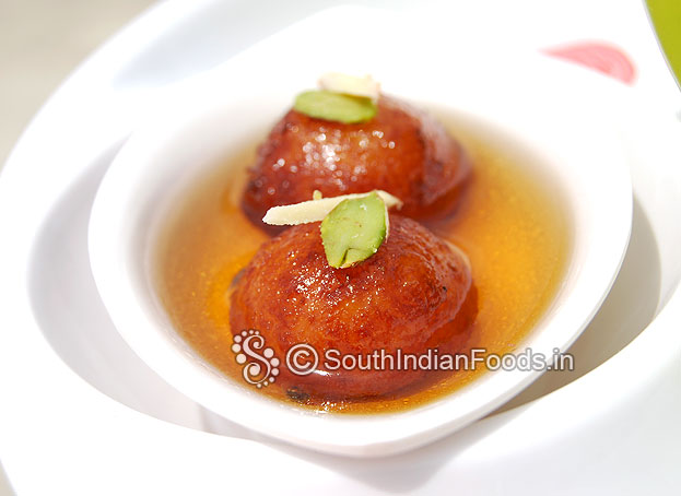 Potato gulab jamun is ready. Garnish with pistachios and serve