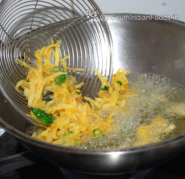 Drop aloo mixture in hot oil, deep fry till crisp and golden brown