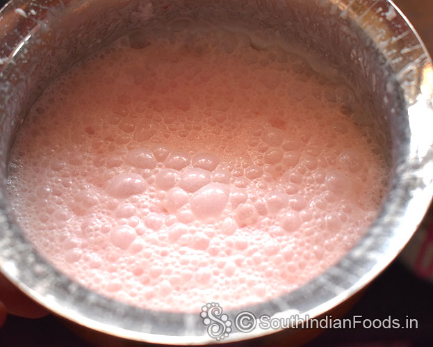 Frothy strawberry jam lassi ready