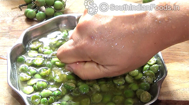 Mash with your hand to remove seeds then drain water