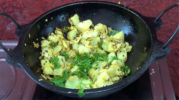 Add coriander leaves, cut off heat, serve hot with rice