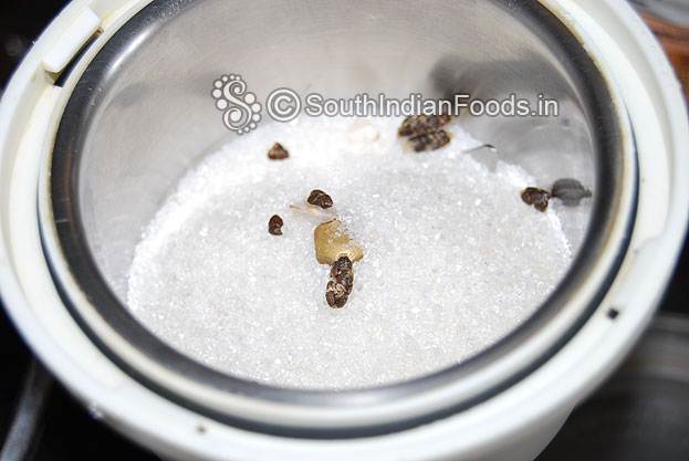 Add sugar and green cardamom seeds in a mixer jar & grind to fine powder.