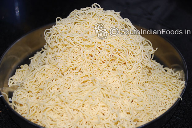 Transfer squeezed thinai idiyappam to a plate