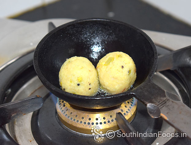 Heat 2 tbsp oil in a iron ladle, add balls, fry till crisp and golden brown