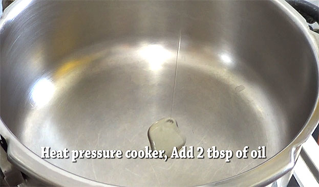 Heat 2 tbsp oil in a pressure cooker