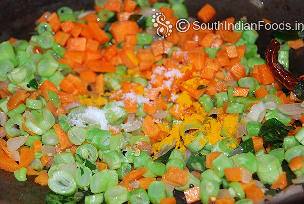Add finely chopped carrot, turmeric powder & salt saute