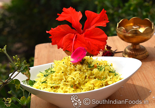 Turmeric coconut rice ready, serve hot with pickle or chips